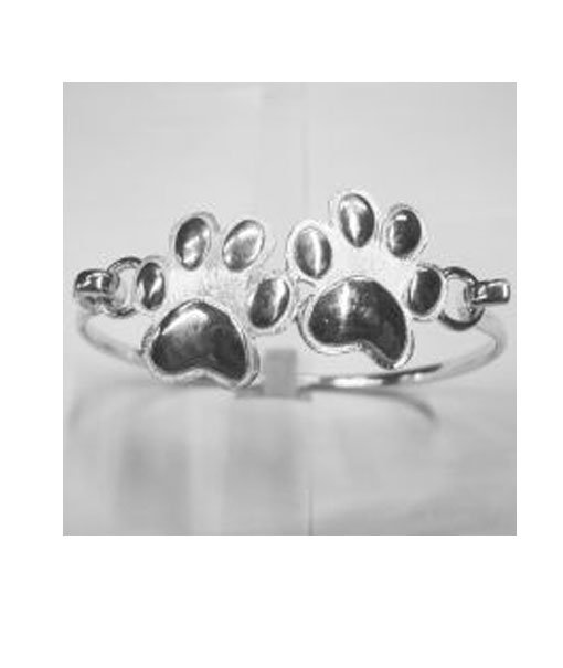 Bracciale rigido in argento con soggetto centrale a forma di due zampine