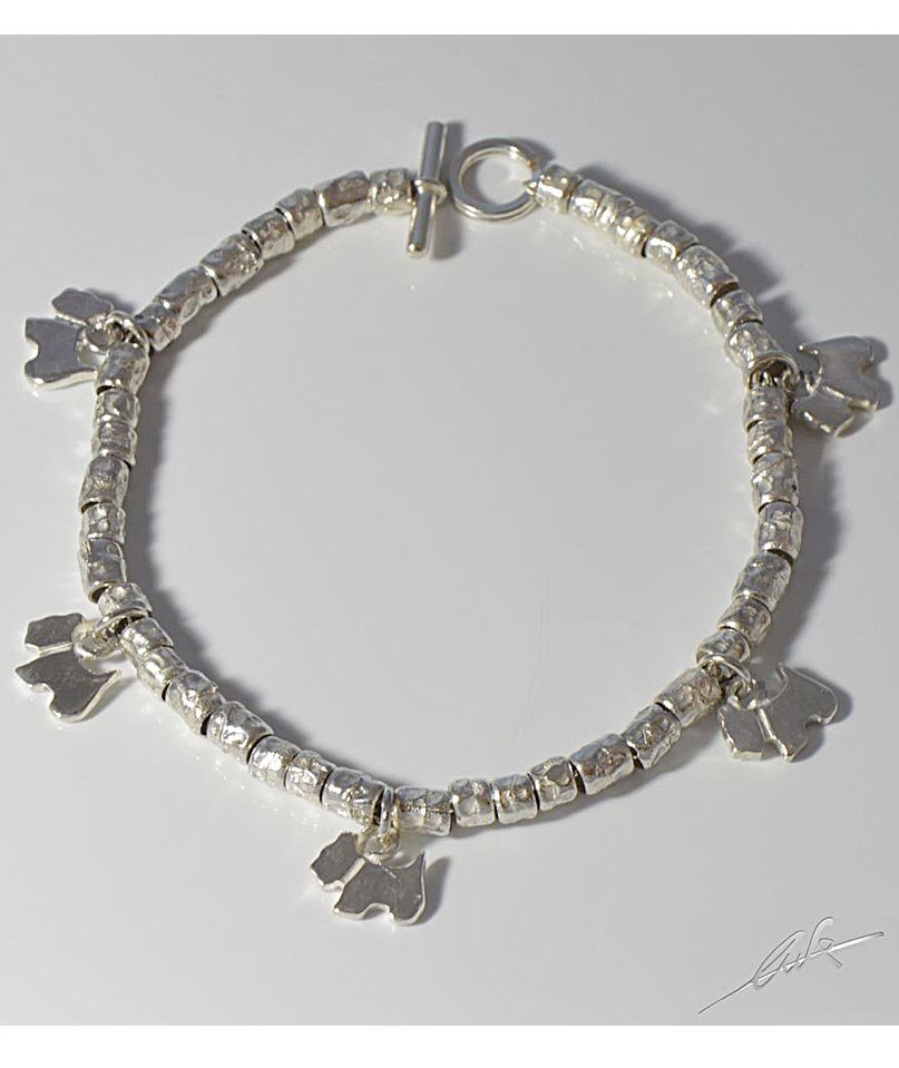 Bracciale a intercalari in argento, con sagome pendenti di cane razza Terrier