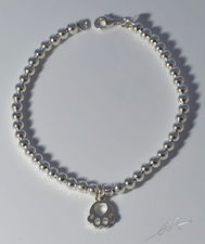 Bracciale palline argento orma pendente