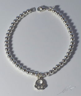 Bracciale palline argento orma pendente