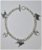 Bracciale a intercalari in argento, con sagome pendenti di orme traforate e cane razza Boston