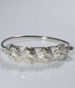 Bracciale rigido Bolognese 4 teste cesellate a mano argento 925